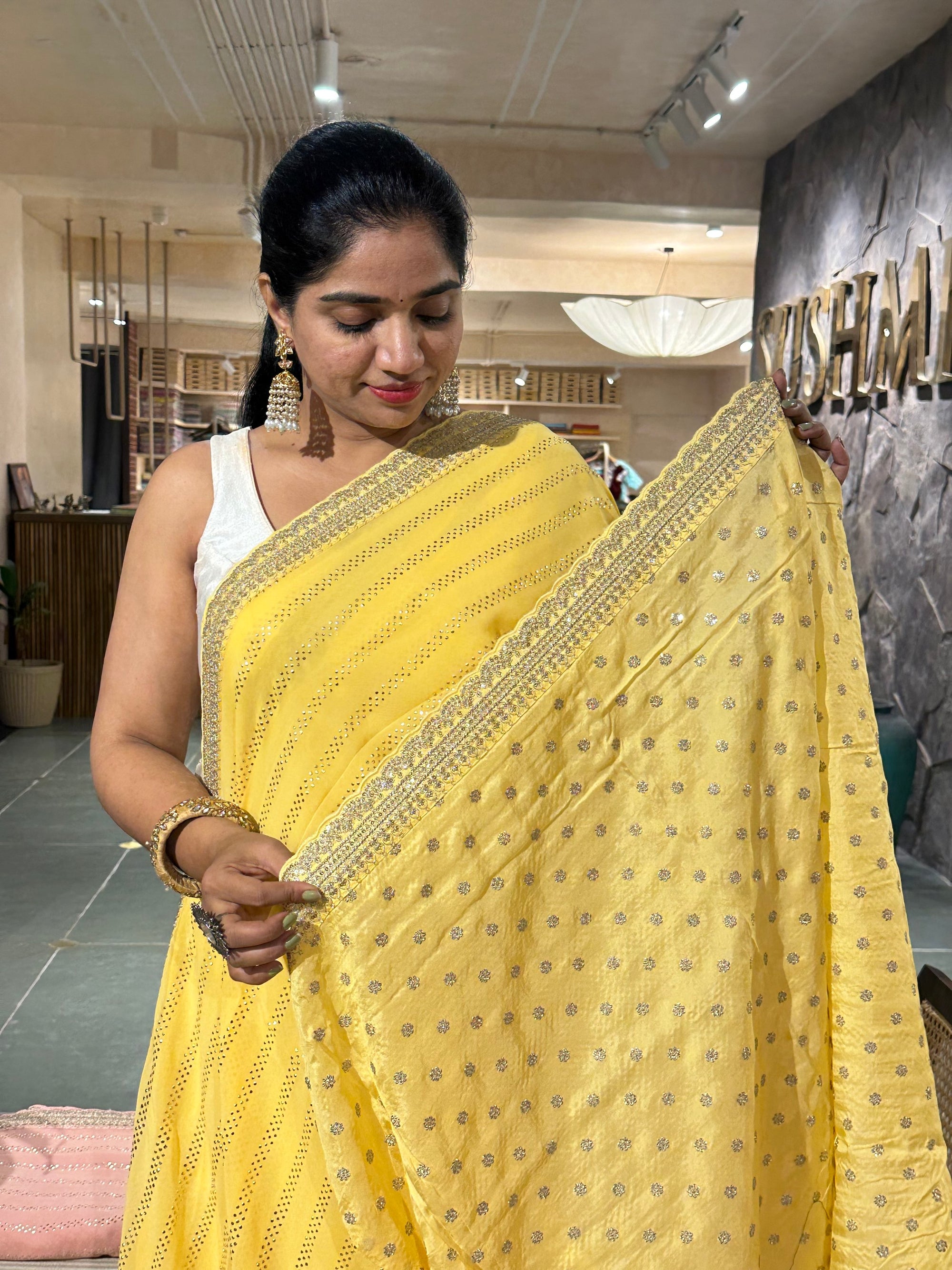 Pastel yellow Pure gorgette Saree with allover bead work  & sabyasachi borders