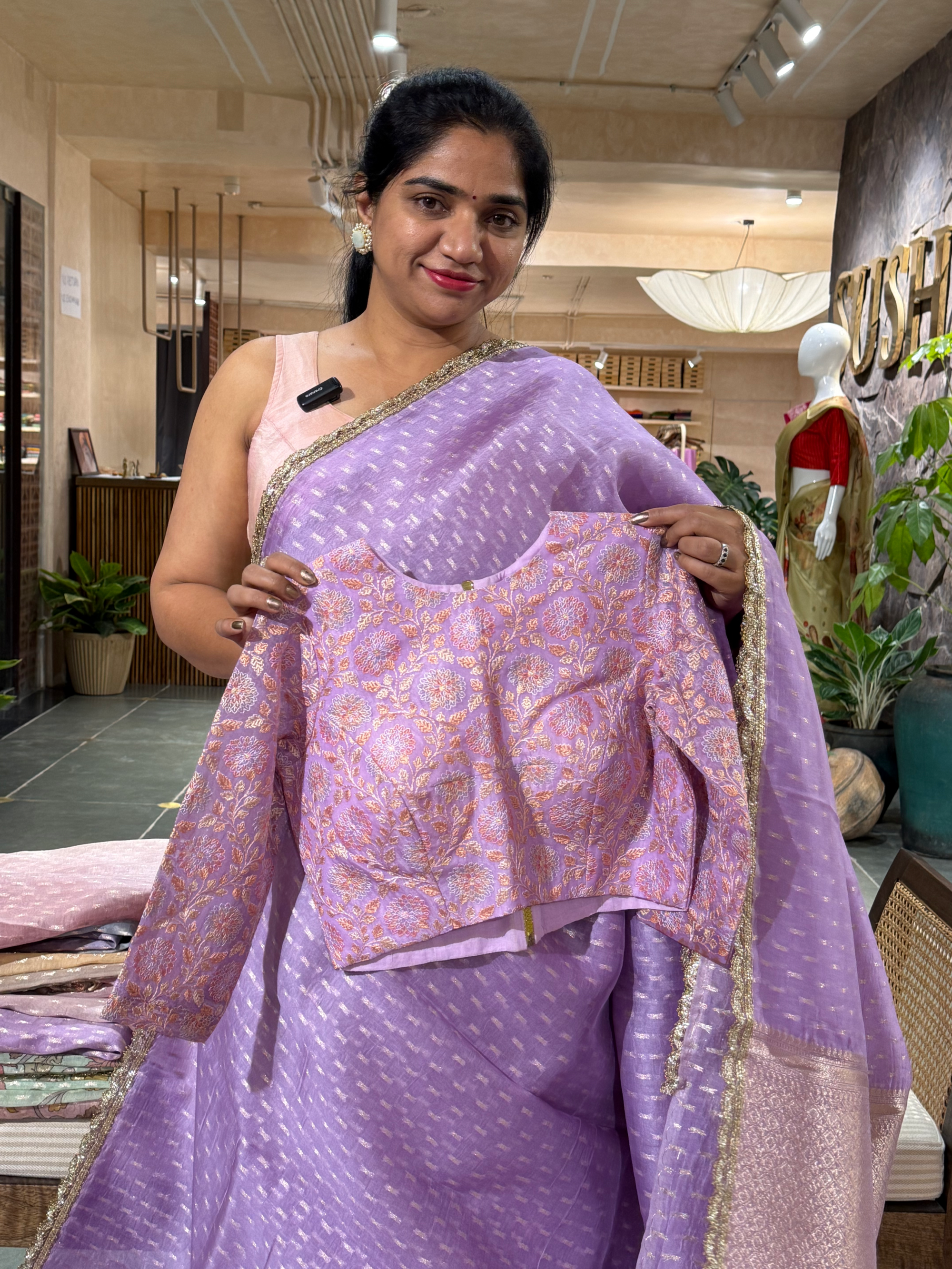 Lilac Pure Organza Saree with allover zari butis paired with Embroidered Blouse