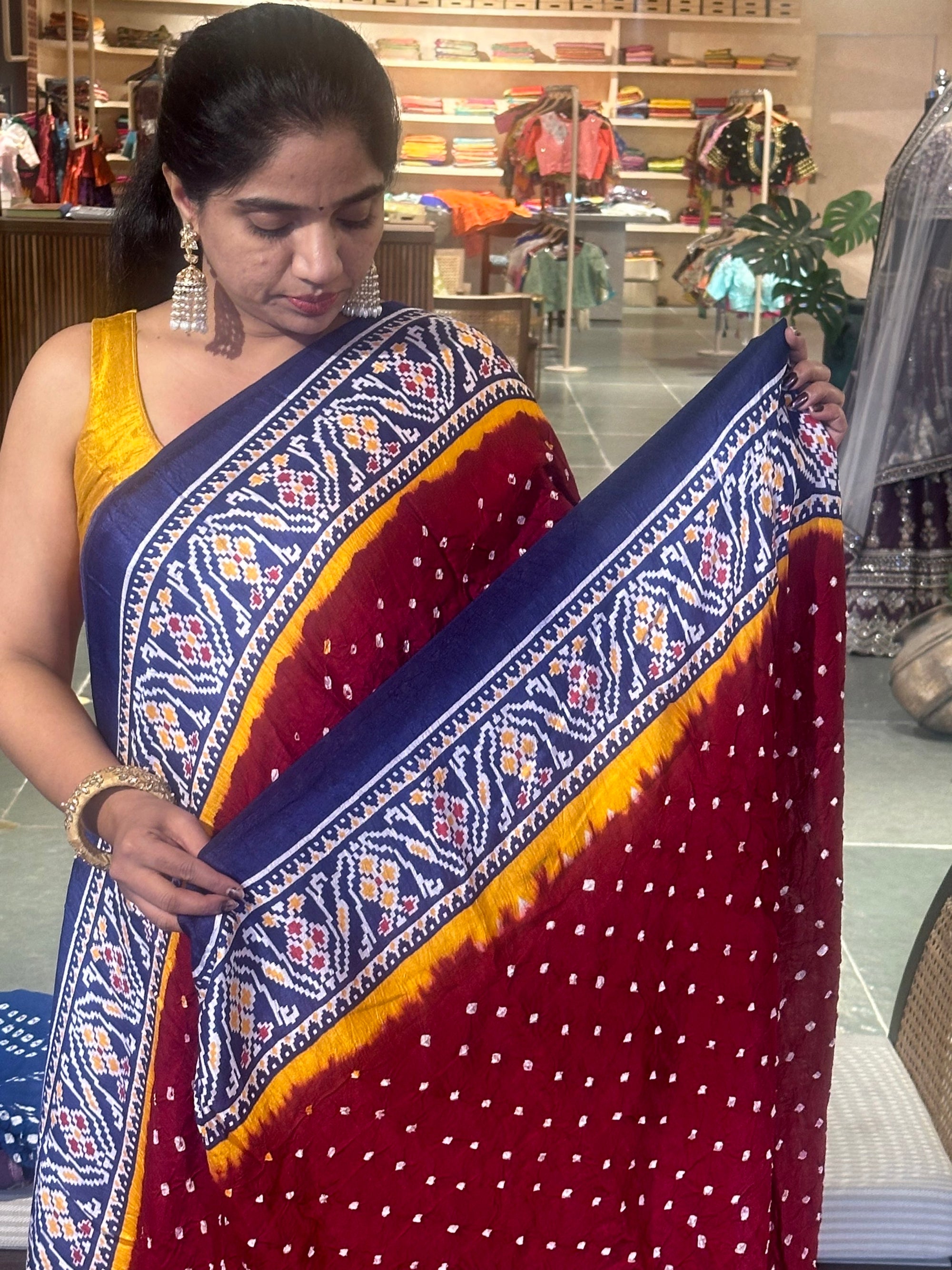 Modal satin Bandhej saree with patola printed border and pallu