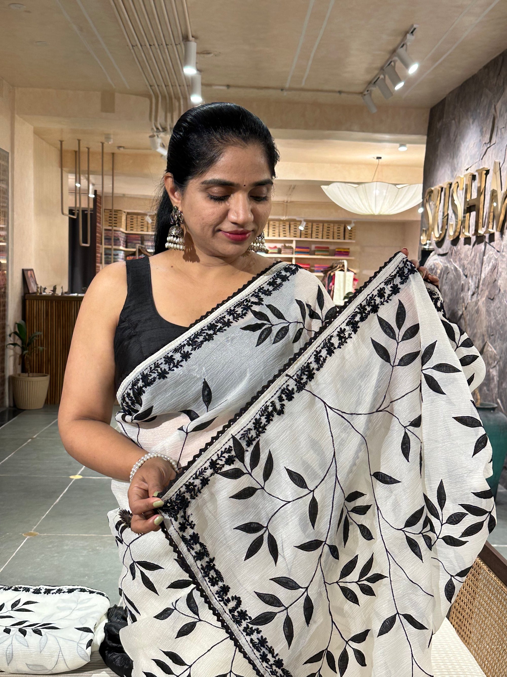 Half white crush Saree with allover applique work in leaf creeper pattern  and h
