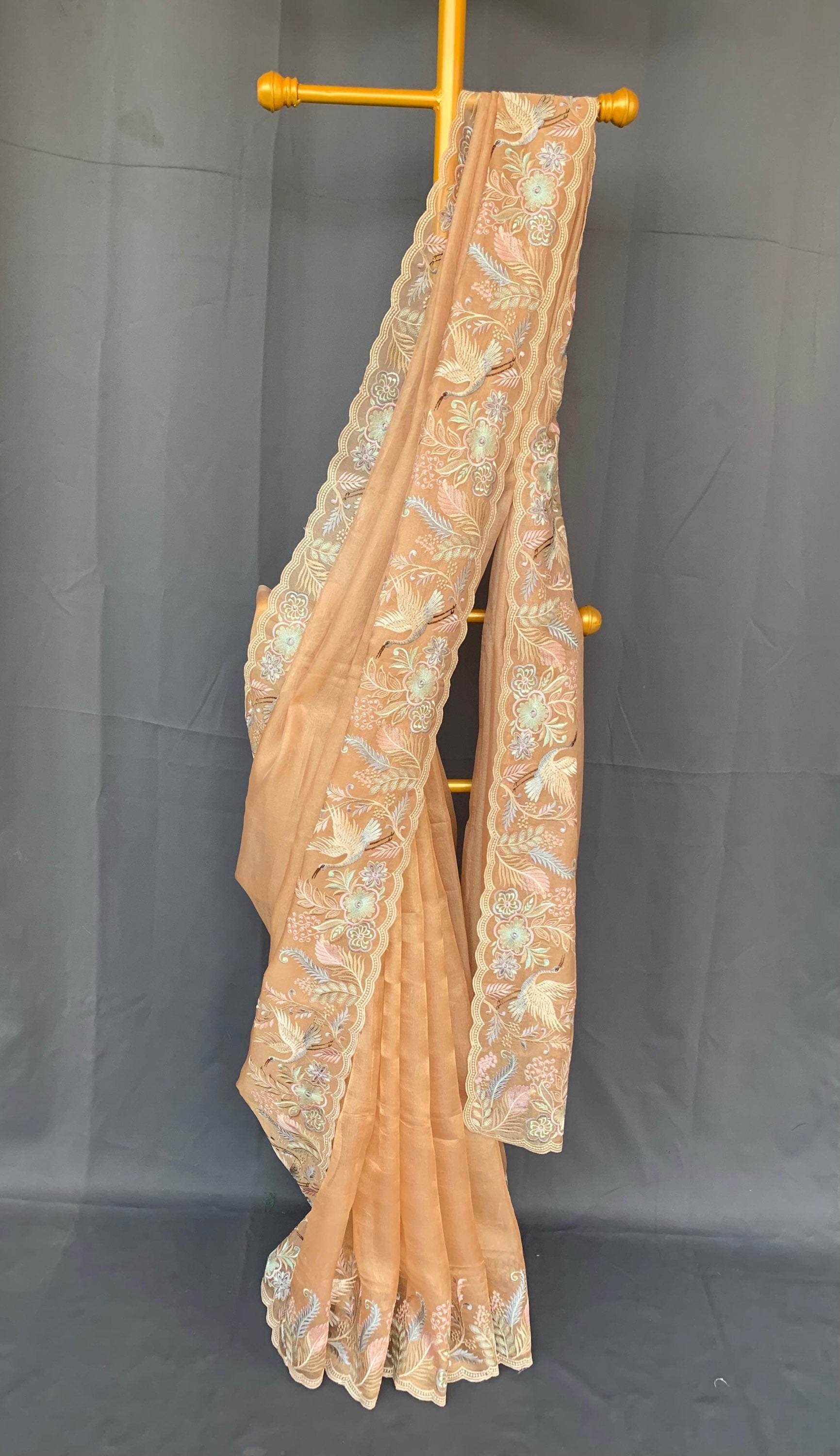 Light Peach  kora Tissue Designer Saree with heavy embroidered Borders .