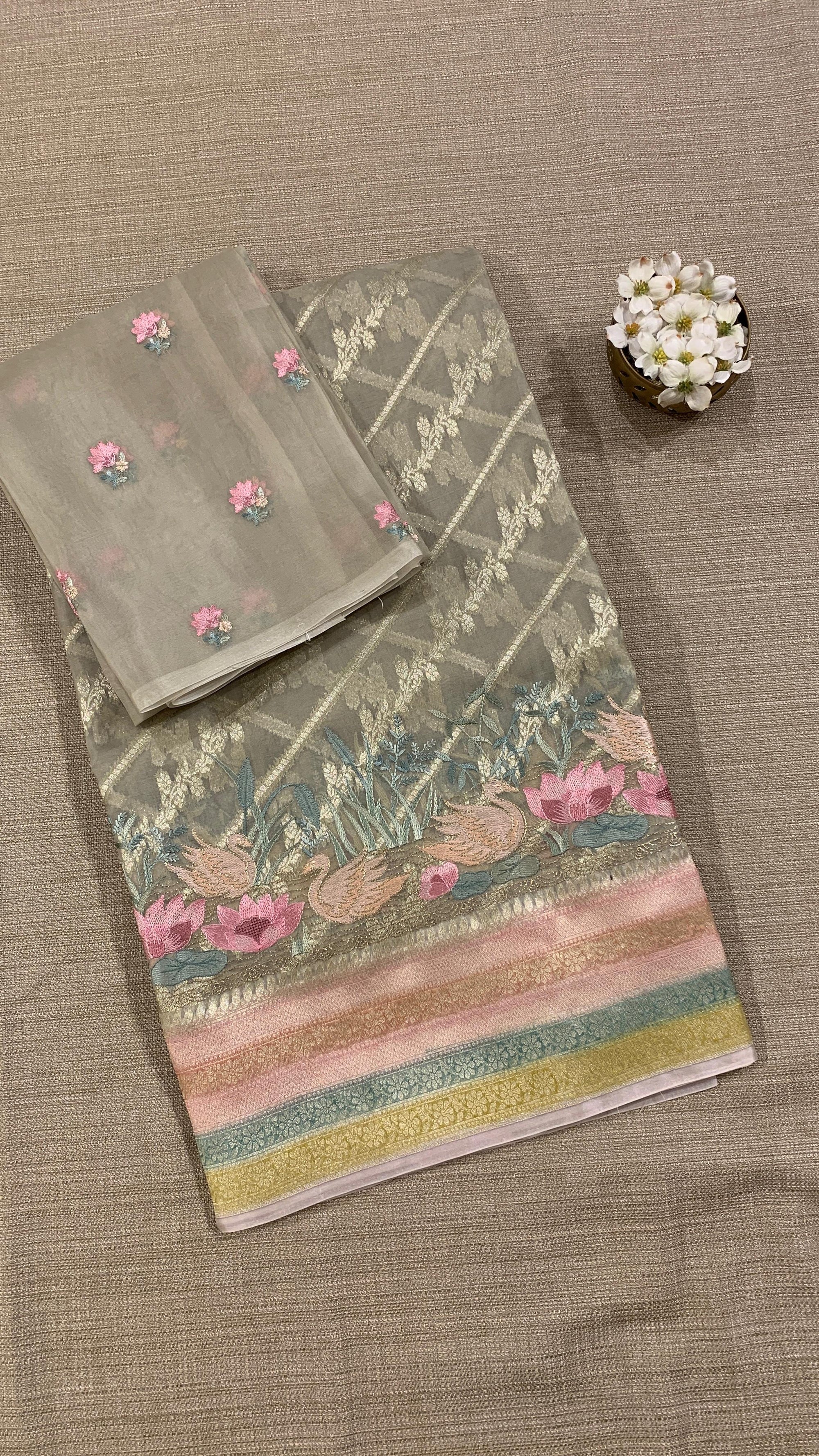 Pure Handloom Kora Banarasi with rangkaat and embroidered borders and blouse.