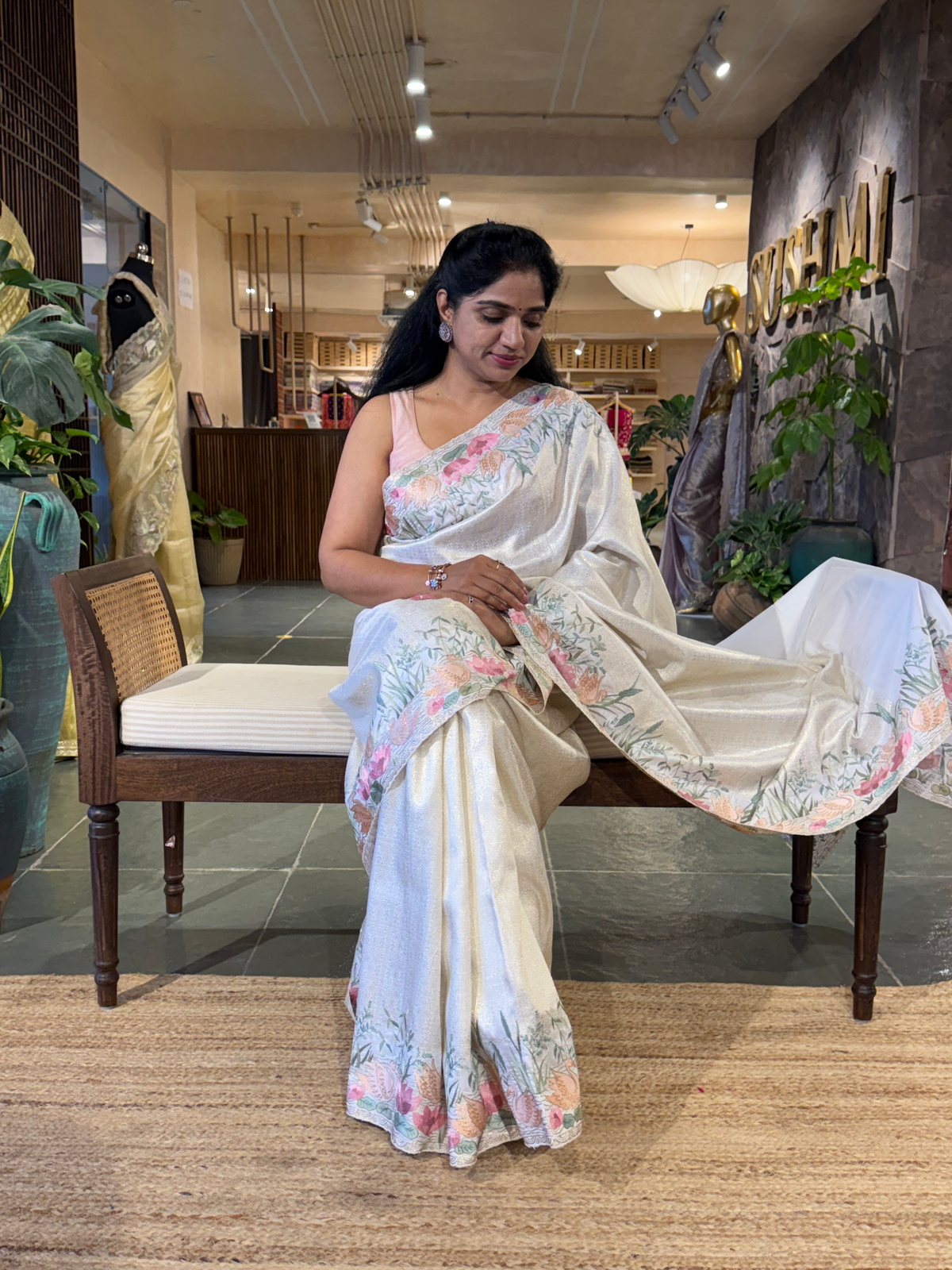 White Kanjeevaram Brocade Saree With Beautiful Pond Theme Embroidered Border.