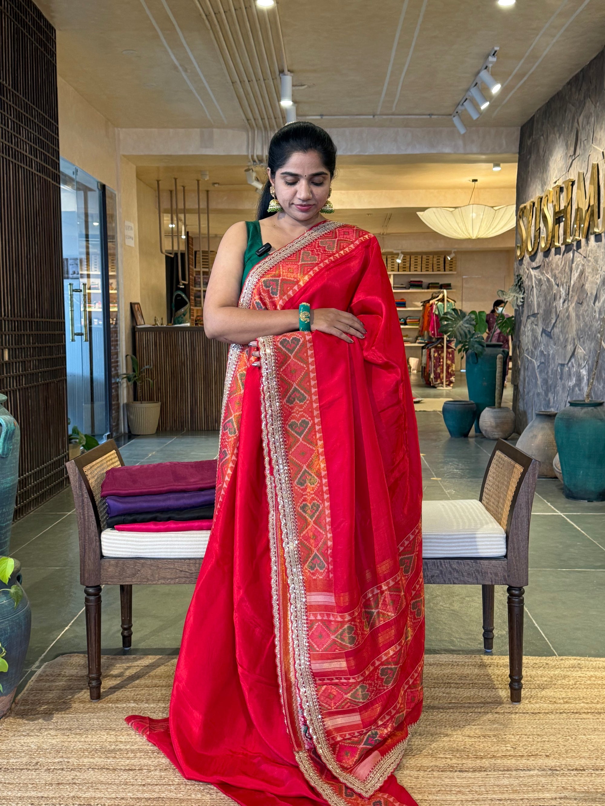 Chilli Red falling Tussar silk saree with Patola borders and Sabhyasachi-style