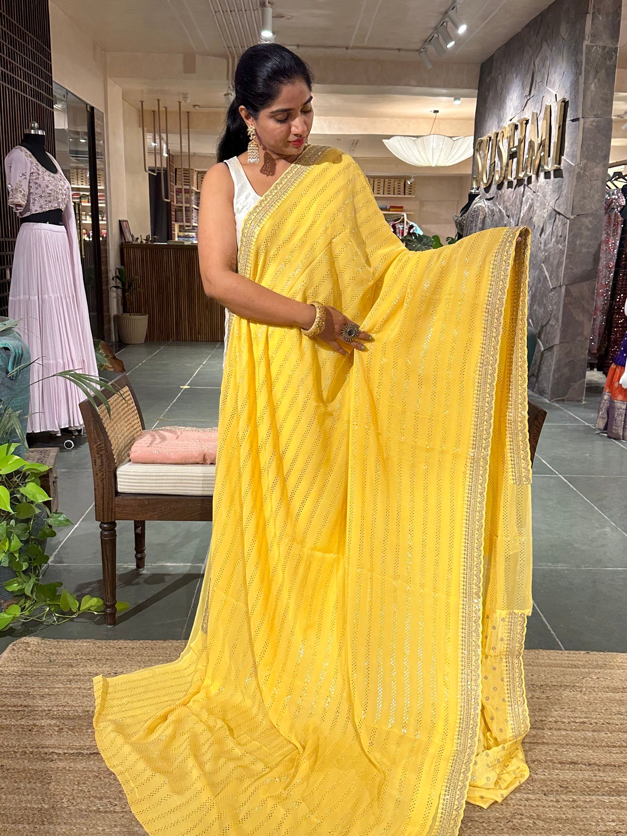 Pastel yellow Pure gorgette Saree with allover bead work  & sabyasachi borders