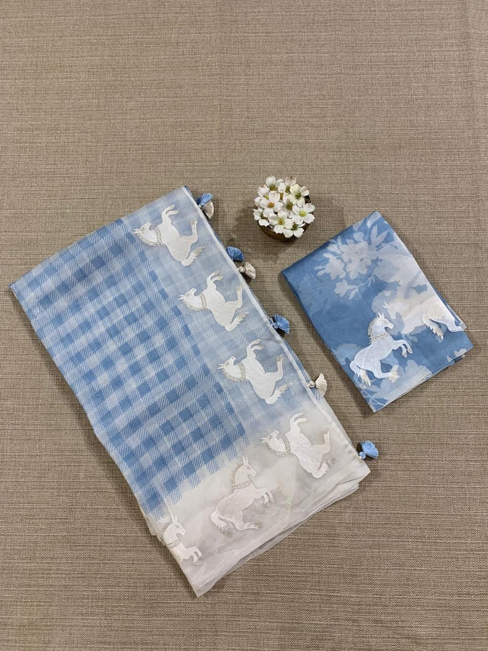 SOCH1302 : White & Blue Organza Saree Wth Embroidered Horse Border & Floral BP
