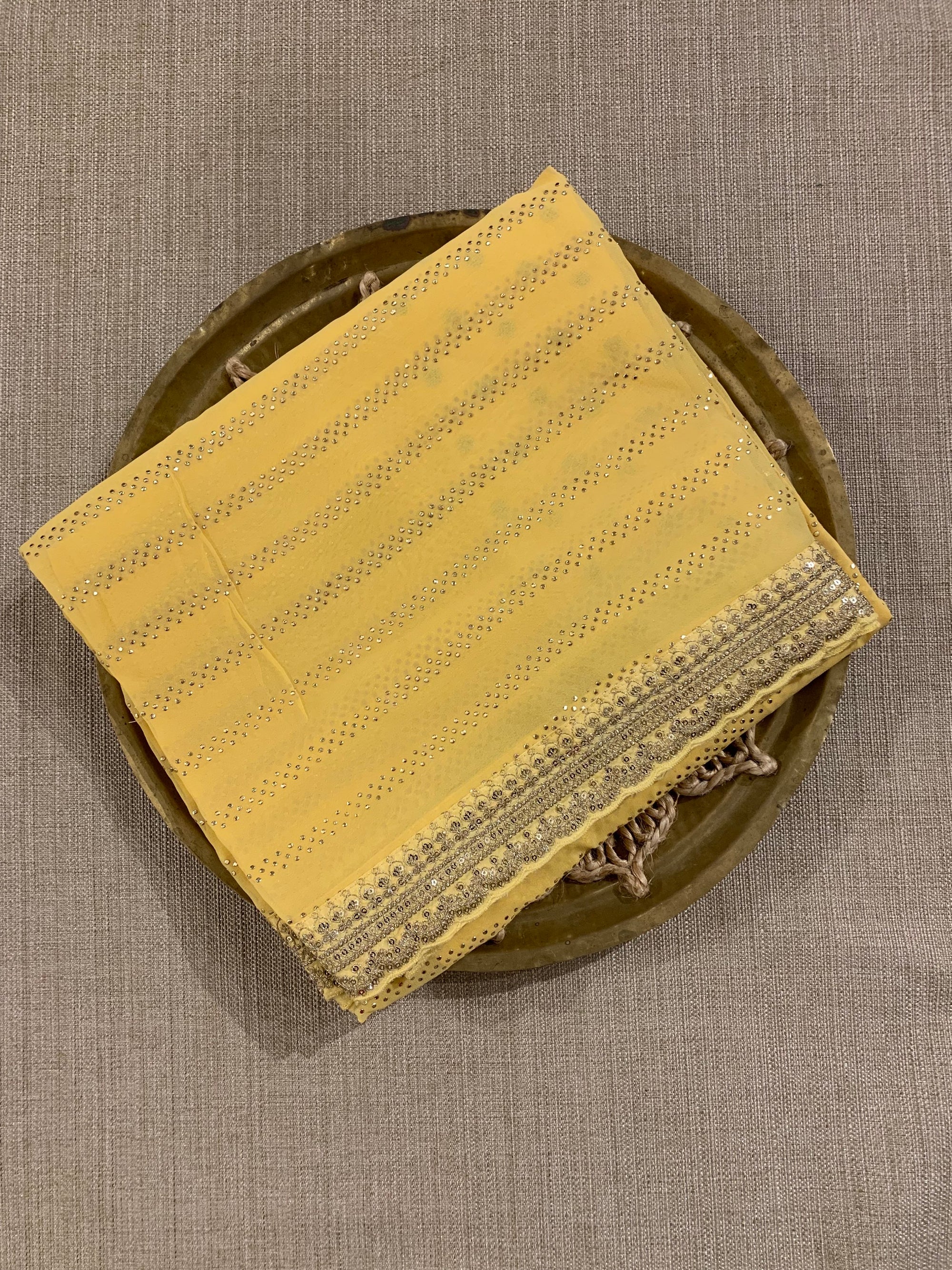Pastel yellow Pure gorgette Saree with allover bead work  & sabyasachi borders