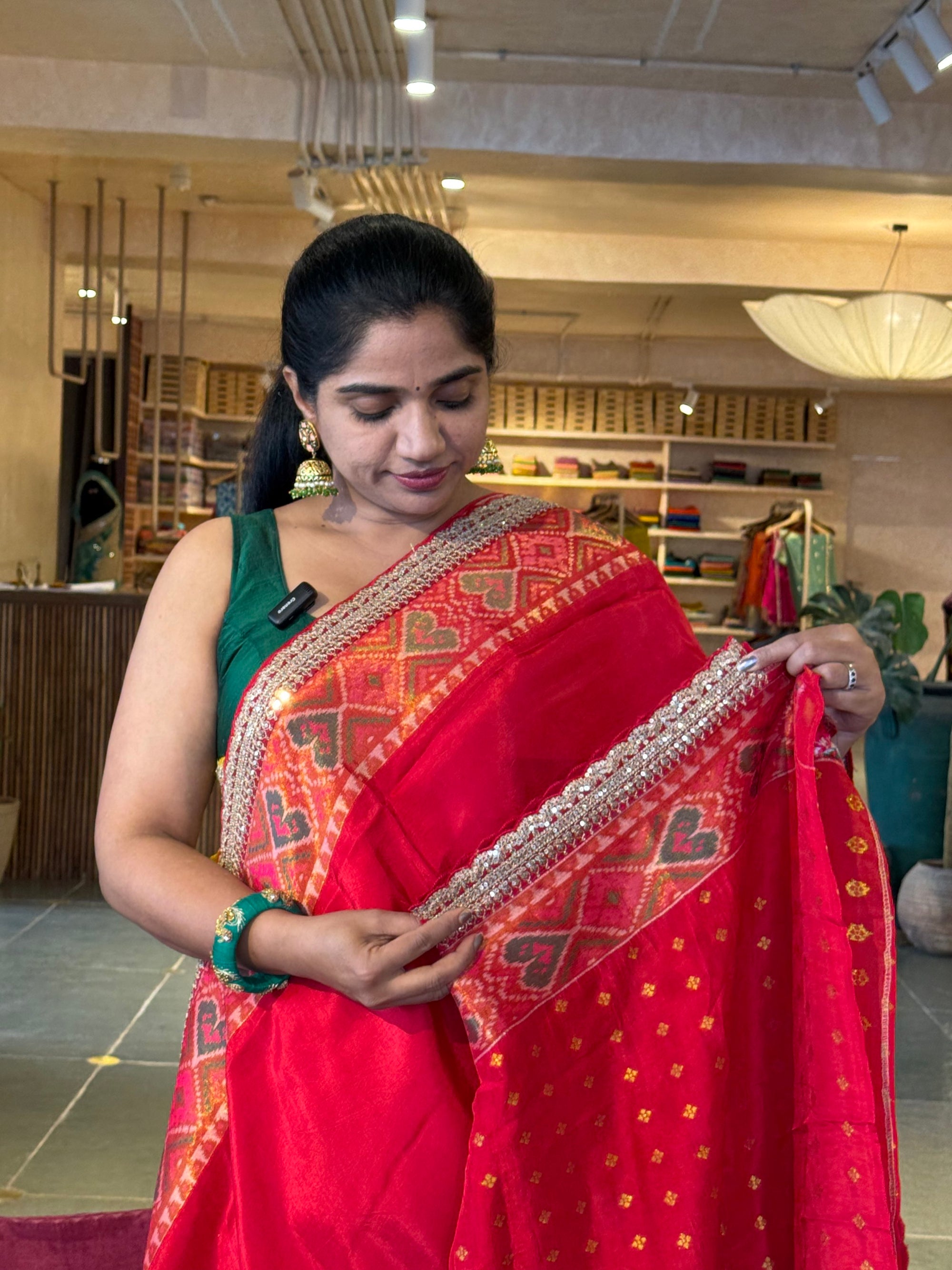 Chilli Red falling Tussar silk saree with Patola borders and Sabhyasachi-style
