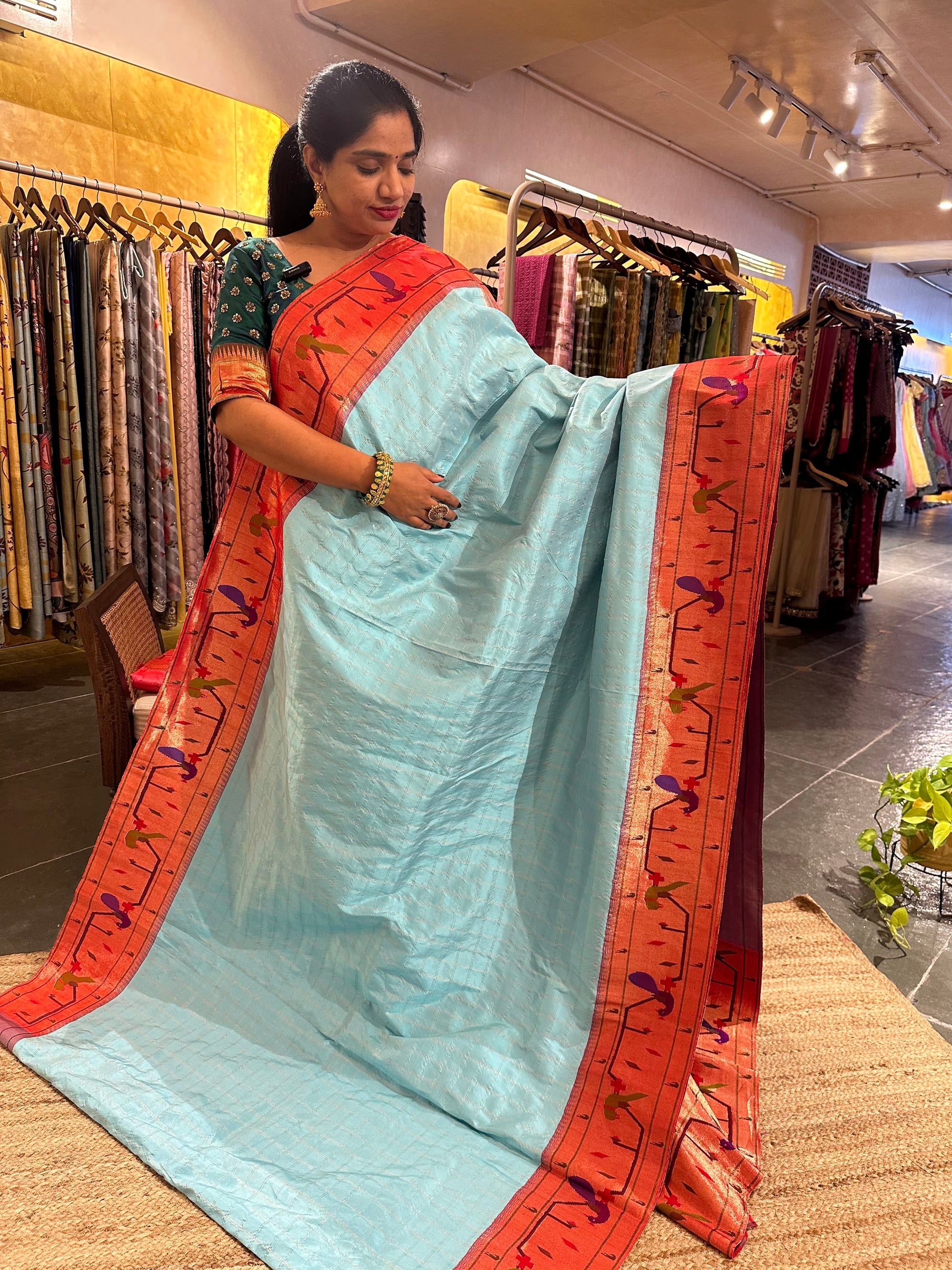 Sky blue checks Pure Pythani saree with parrot peacock border