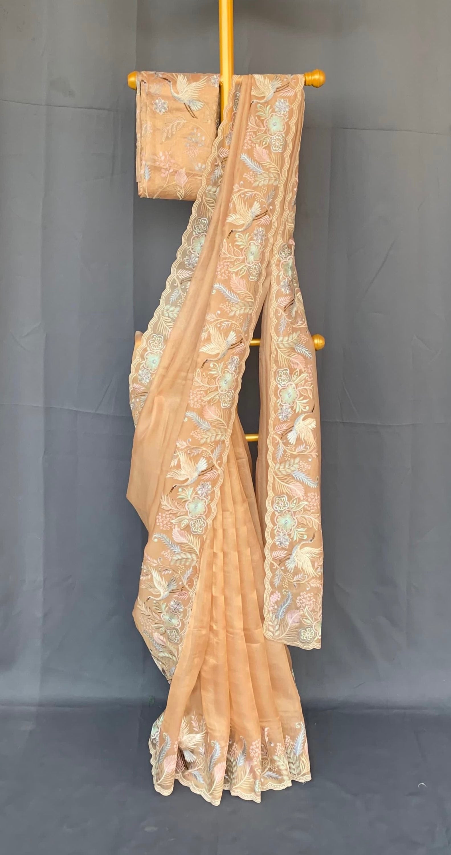 Light Peach  kora Tissue Designer Saree with heavy embroidered Borders .