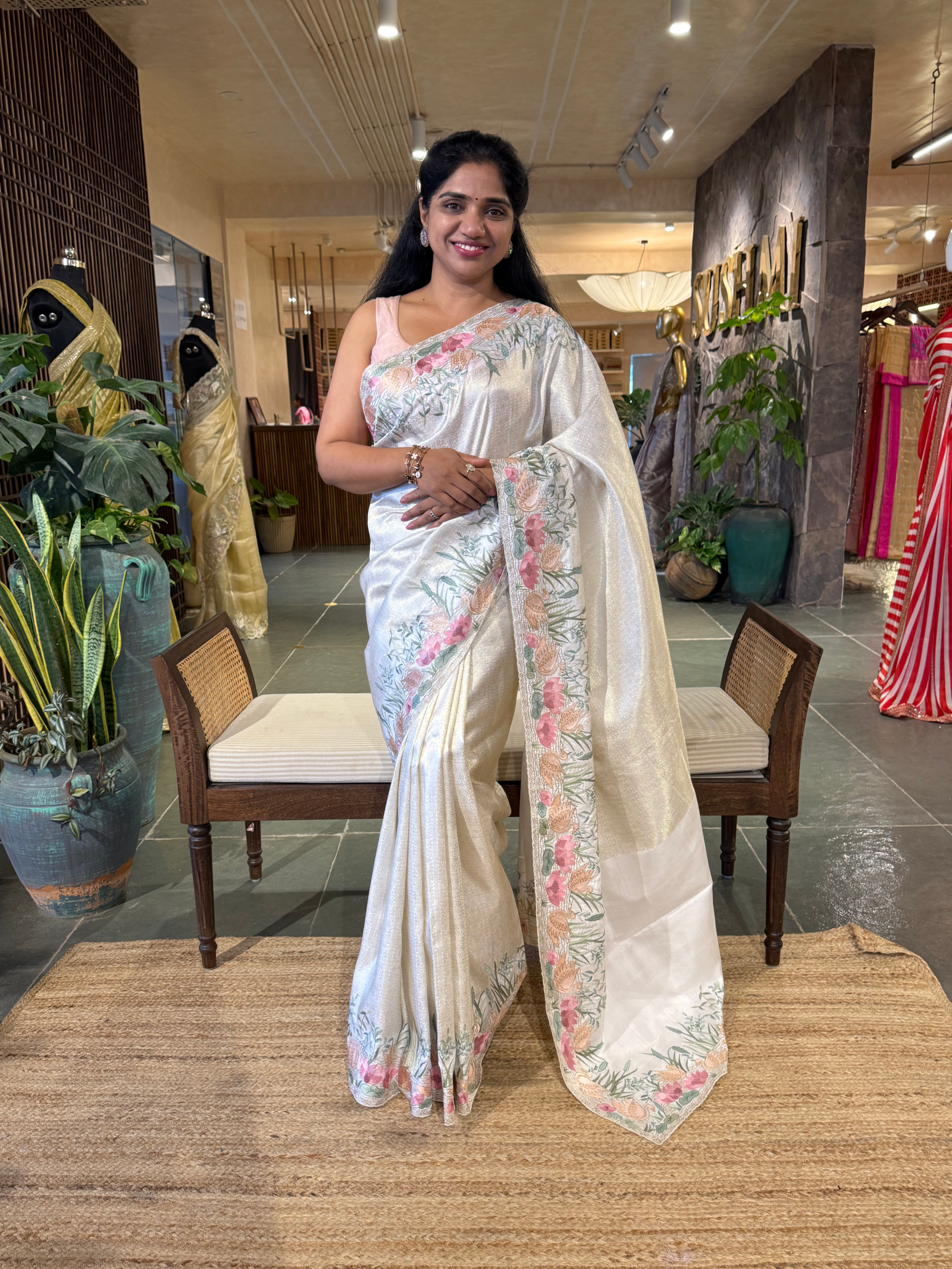 White Kanjeevaram Brocade Saree With Beautiful Pond Theme Embroidered Border.