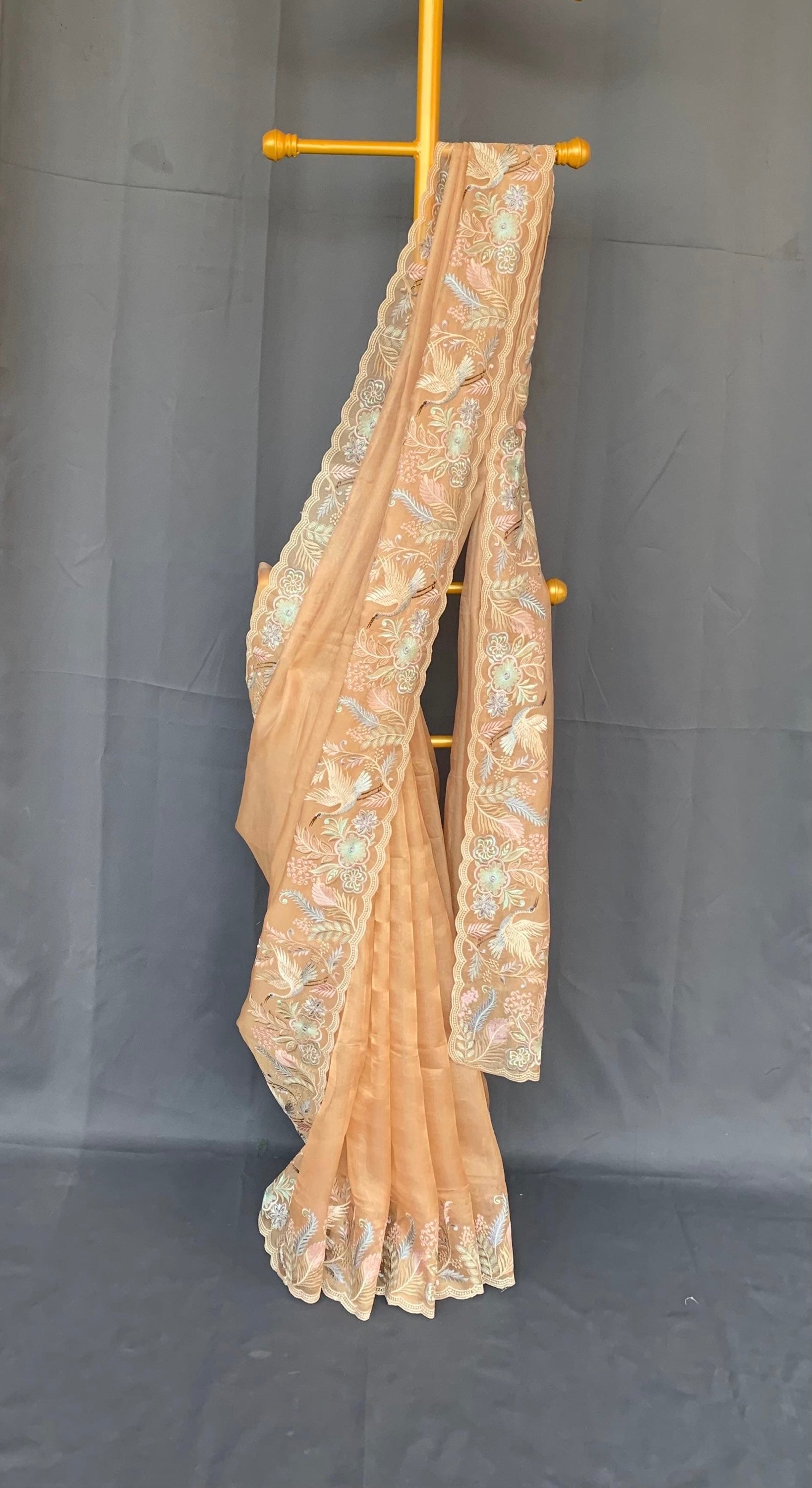 Light Peach  kora Tissue Designer Saree with heavy embroidered Borders .