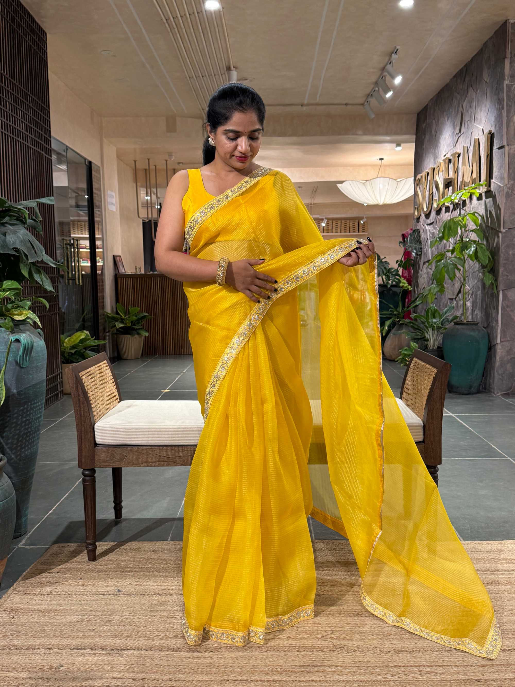 SOSSM2901 Yellow Organza Saree hemlined with Sabhyasachi Borders