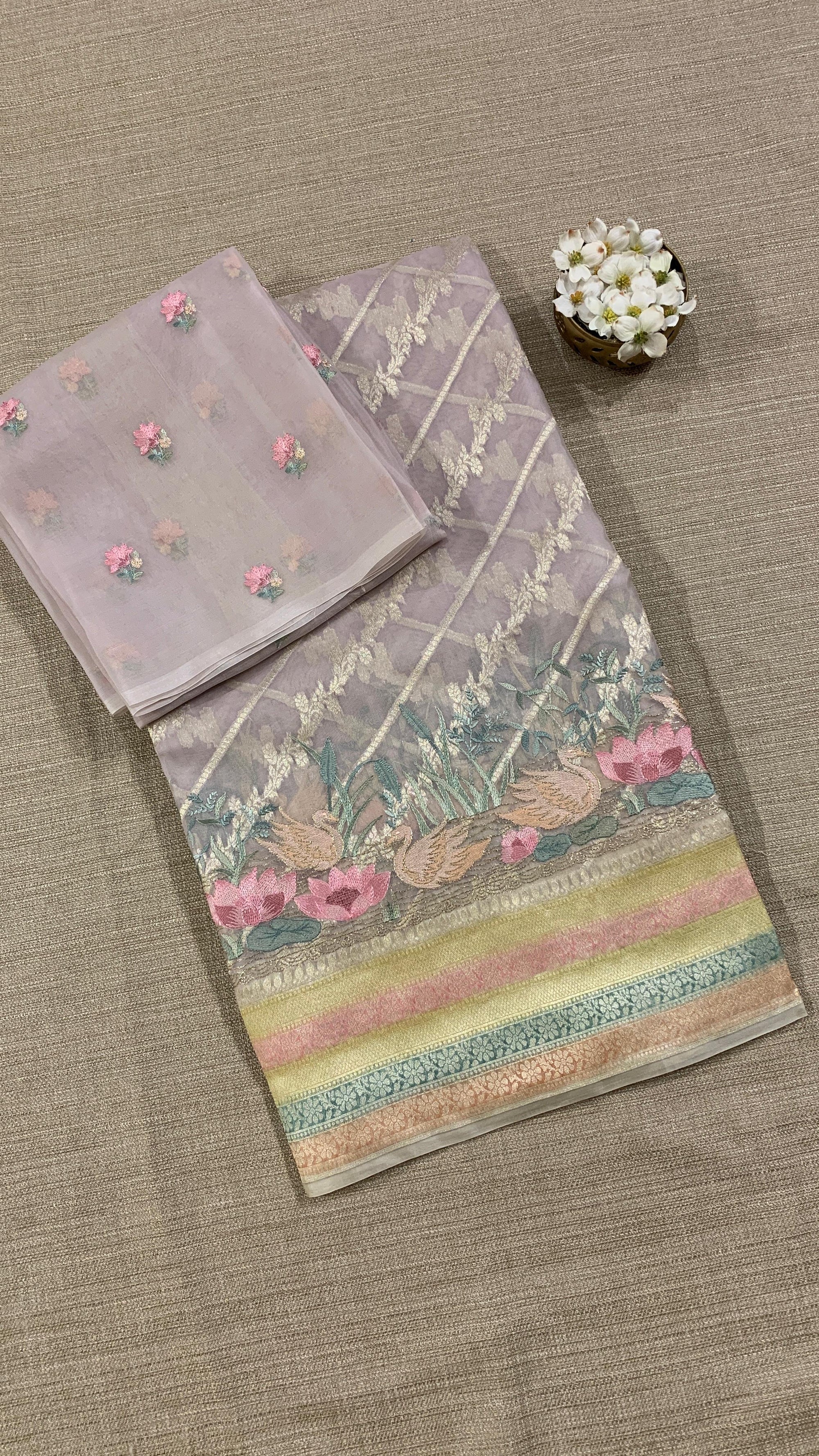 Pure Handloom Kora Banarasi with rangkaat and embroidered borders and blouse.