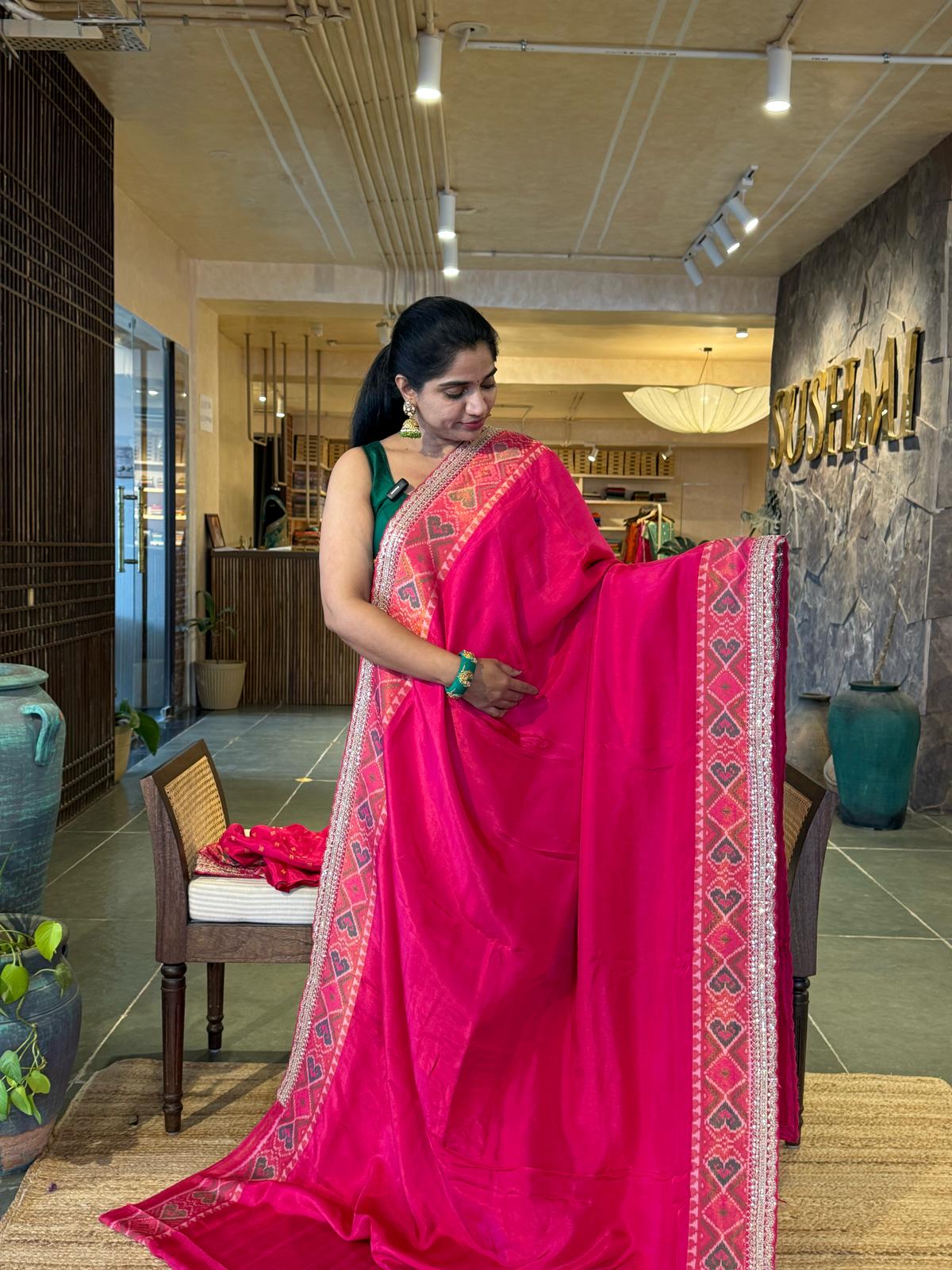 Rani pink falling Tussar silk saree with Patola borders and Sabhyasachi-style