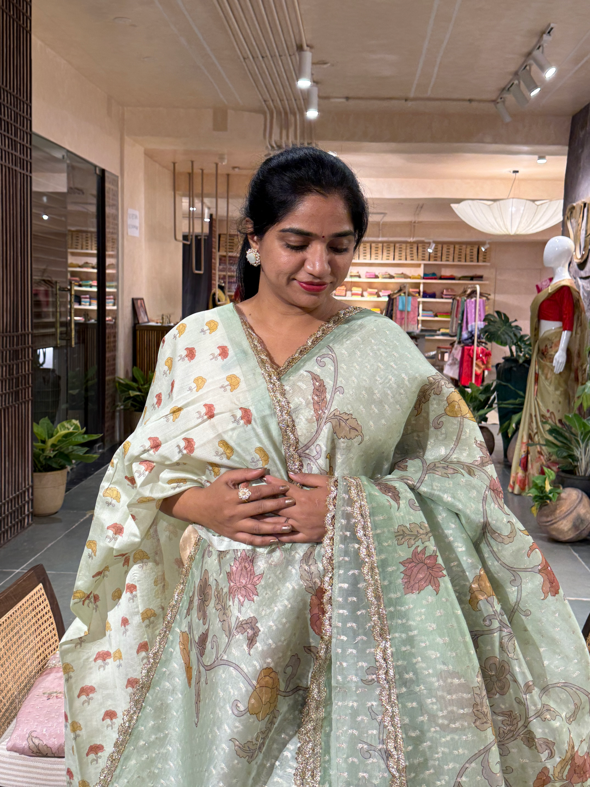 Mint Green Pure Organza Saree with allover zari butis and floral print paired wi