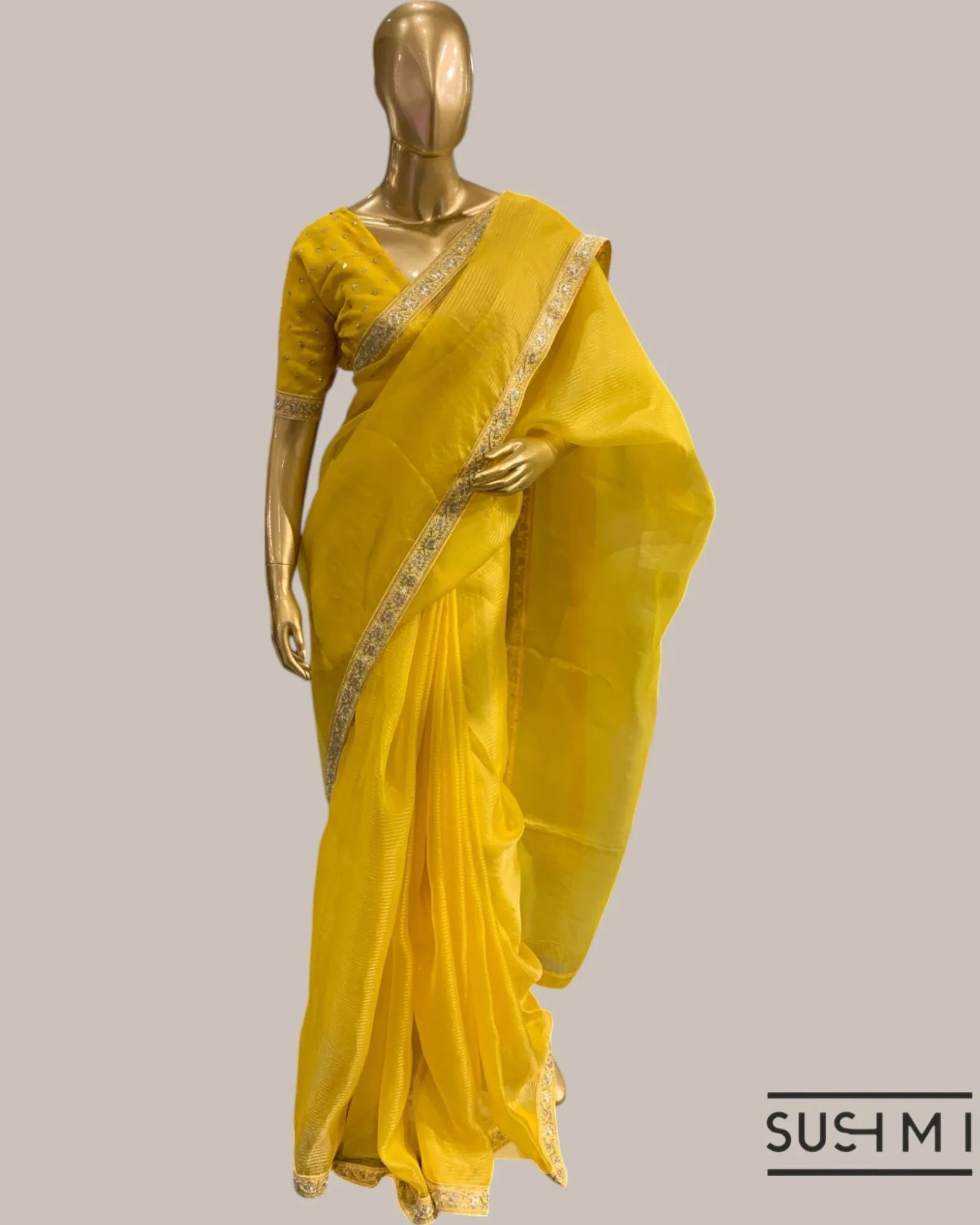 Yellow Organza Saree with Zari stripes Hemlined with sabhyasachi border and blou