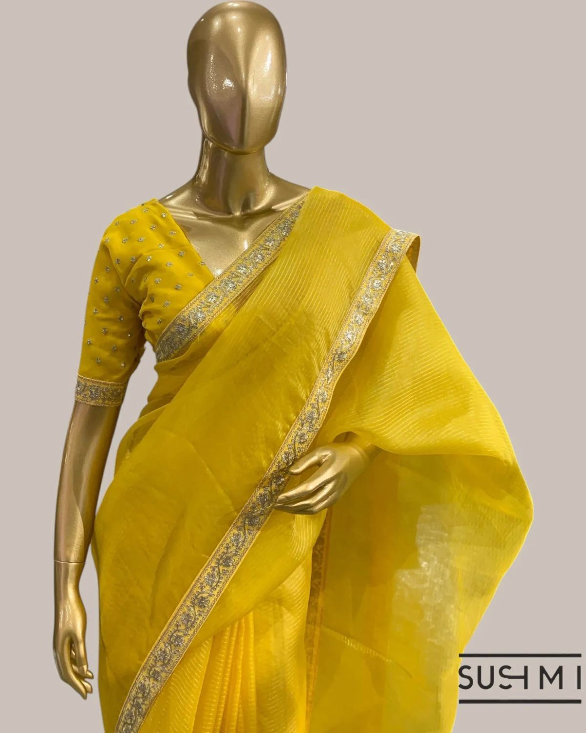 Yellow Organza Saree with Zari stripes Hemlined with sabhyasachi border and blou