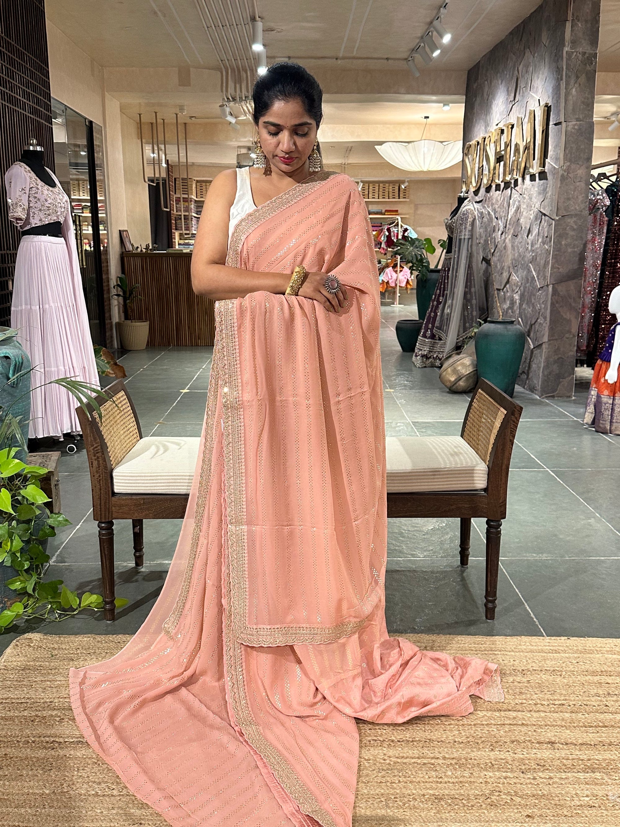 Salmon Pink Pure gorgette Saree with allover bead work  & sabyasachi borders
