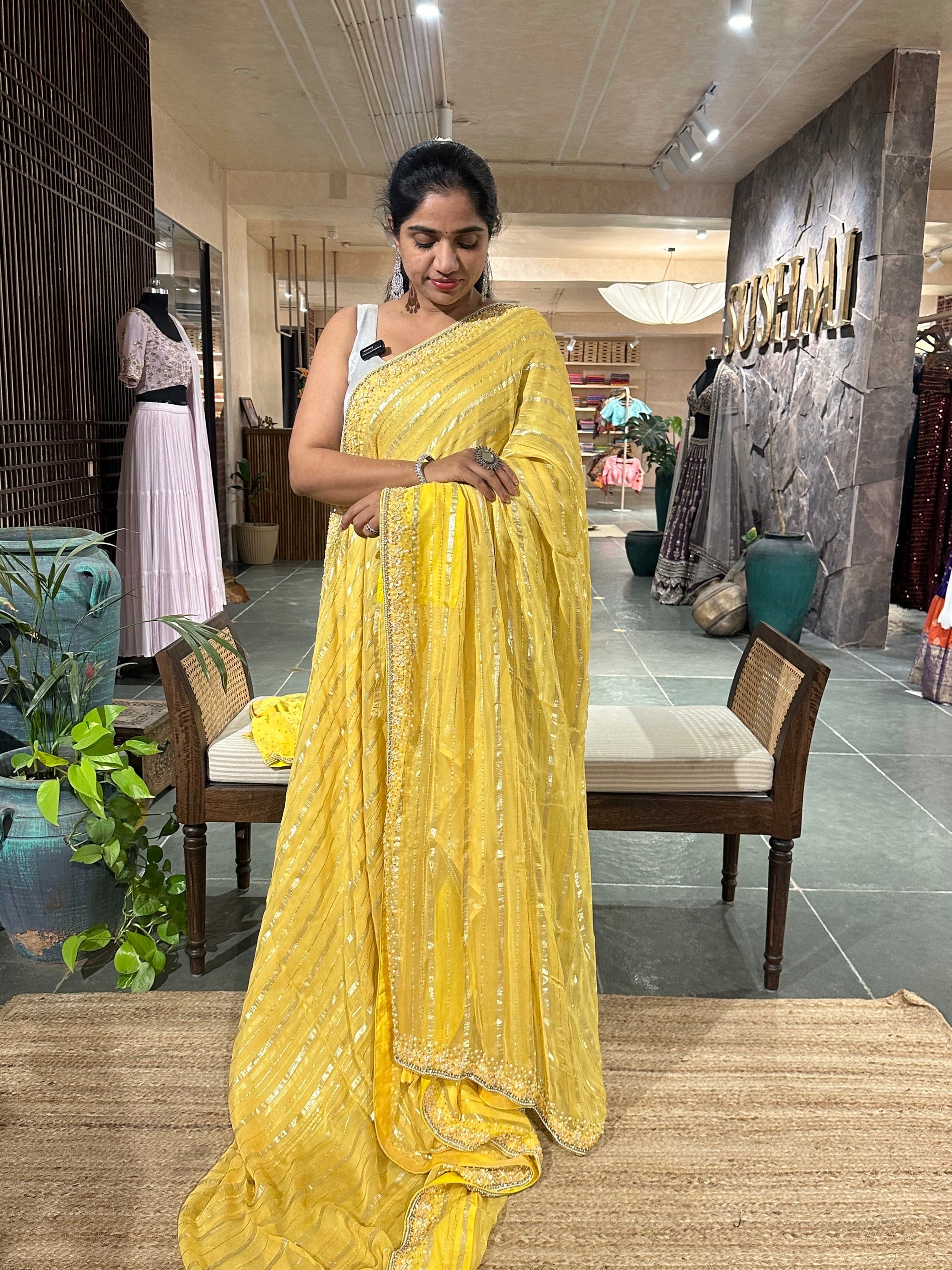 Yellow shaded Chiffon Saree  with  golden stripes , handwork on saree Blouse