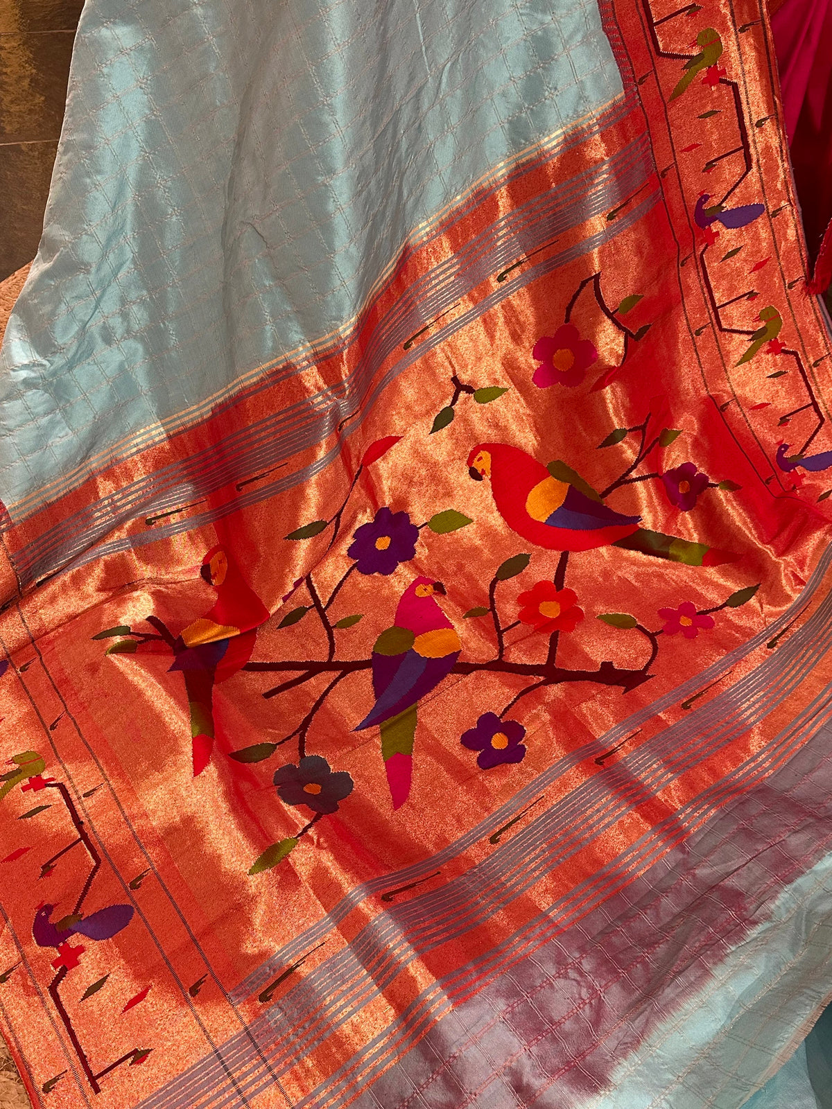 Sky blue checks Pure Pythani saree with parrot peacock border