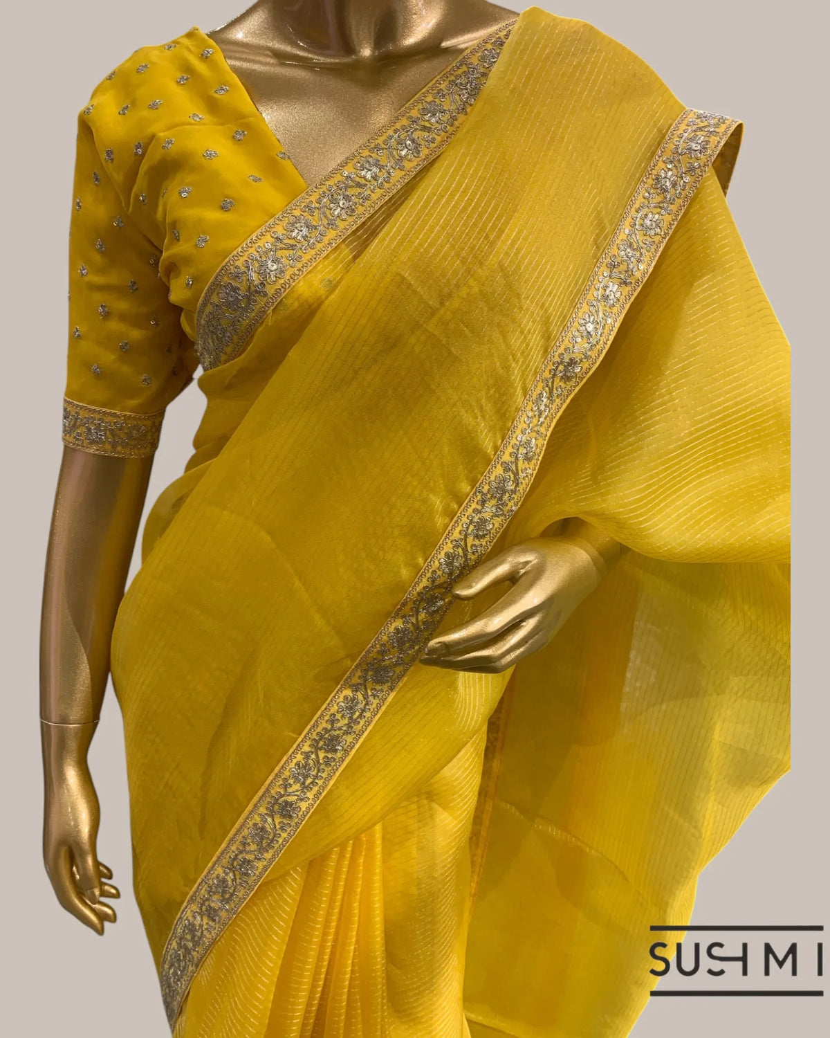 Yellow Organza Saree with Zari stripes Hemlined with sabhyasachi border and blou