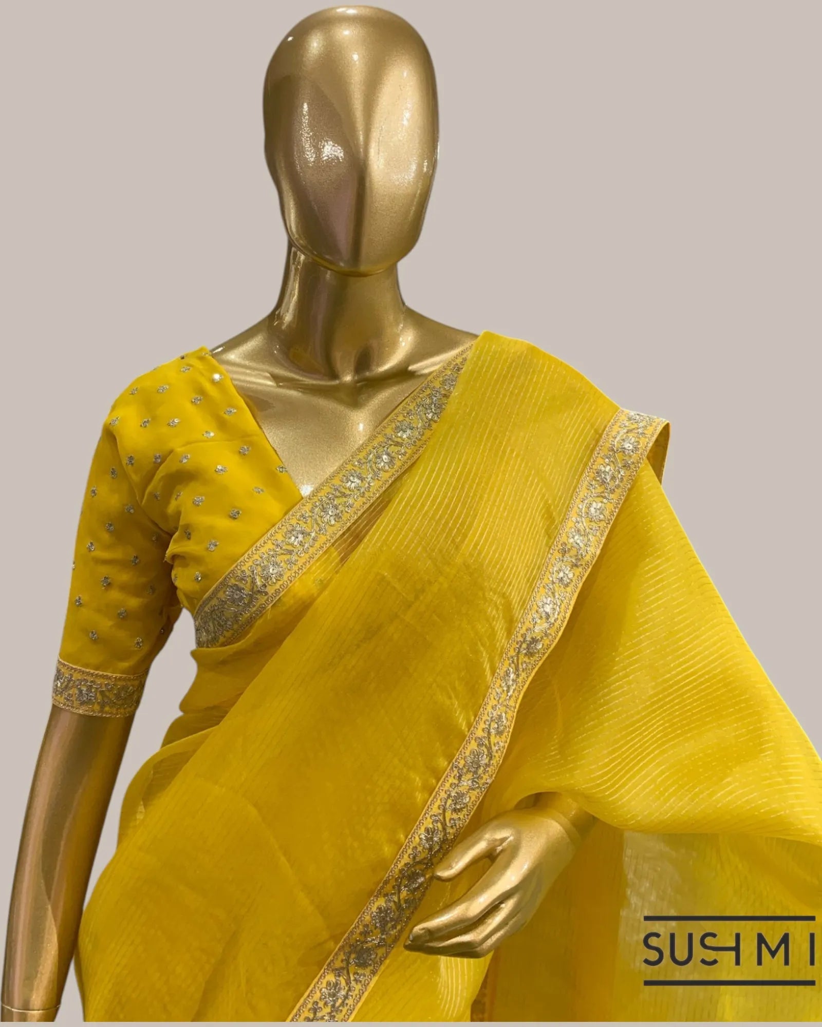 Yellow Organza Saree with Zari stripes Hemlined with sabhyasachi border and blou