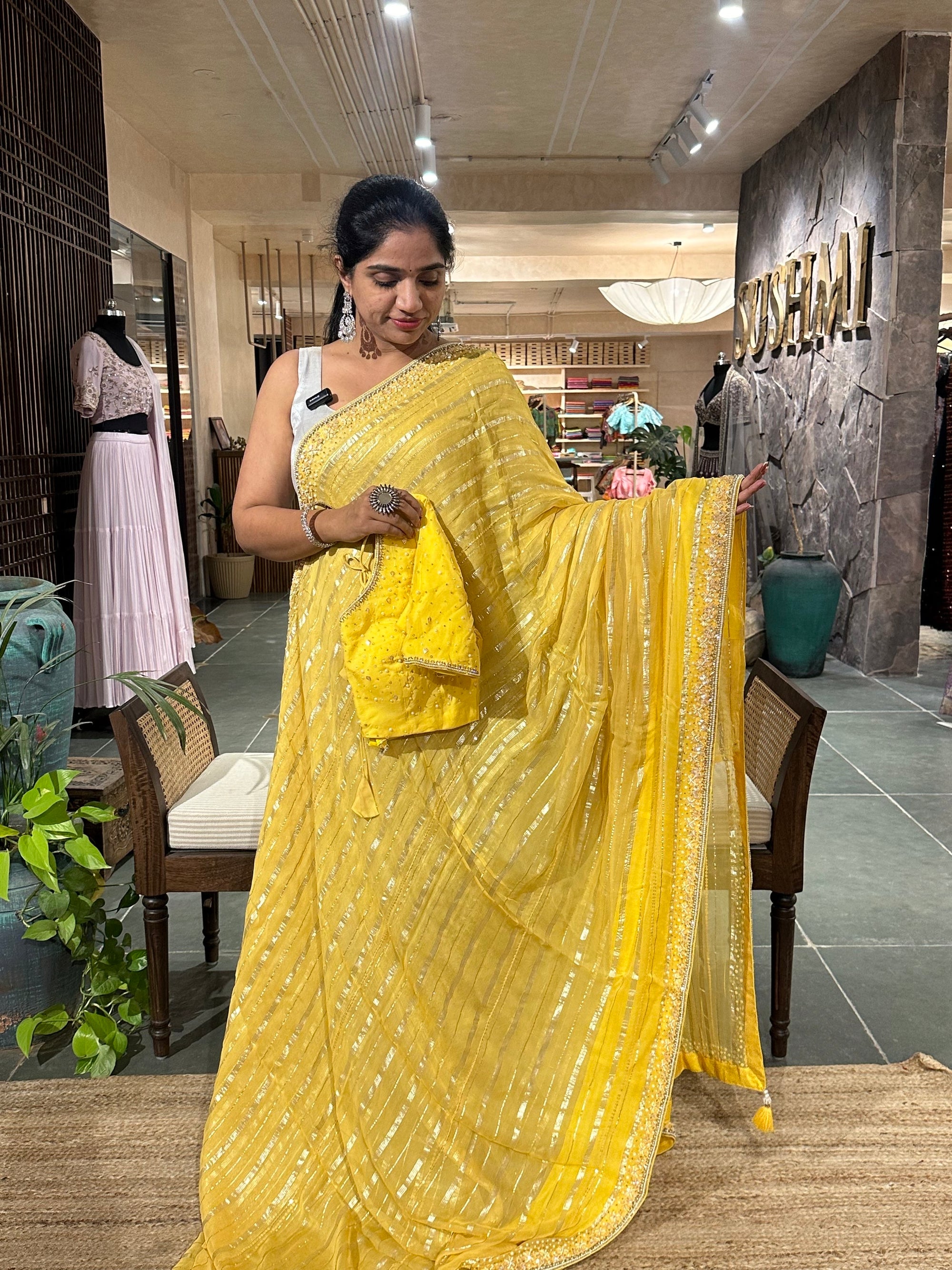 Yellow shaded Chiffon Saree  with  golden stripes , handwork on saree Blouse