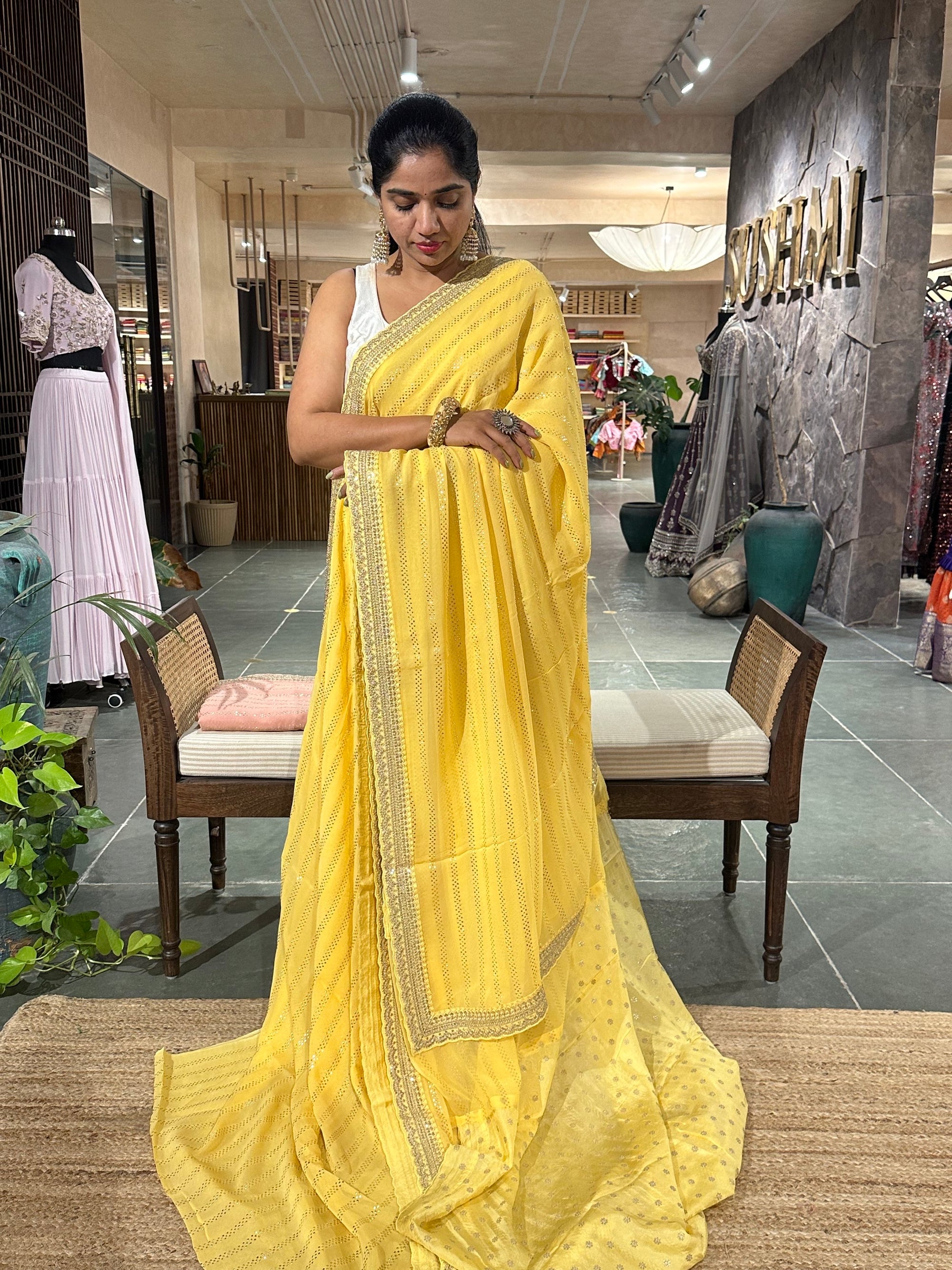Pastel yellow Pure gorgette Saree with allover bead work  & sabyasachi borders