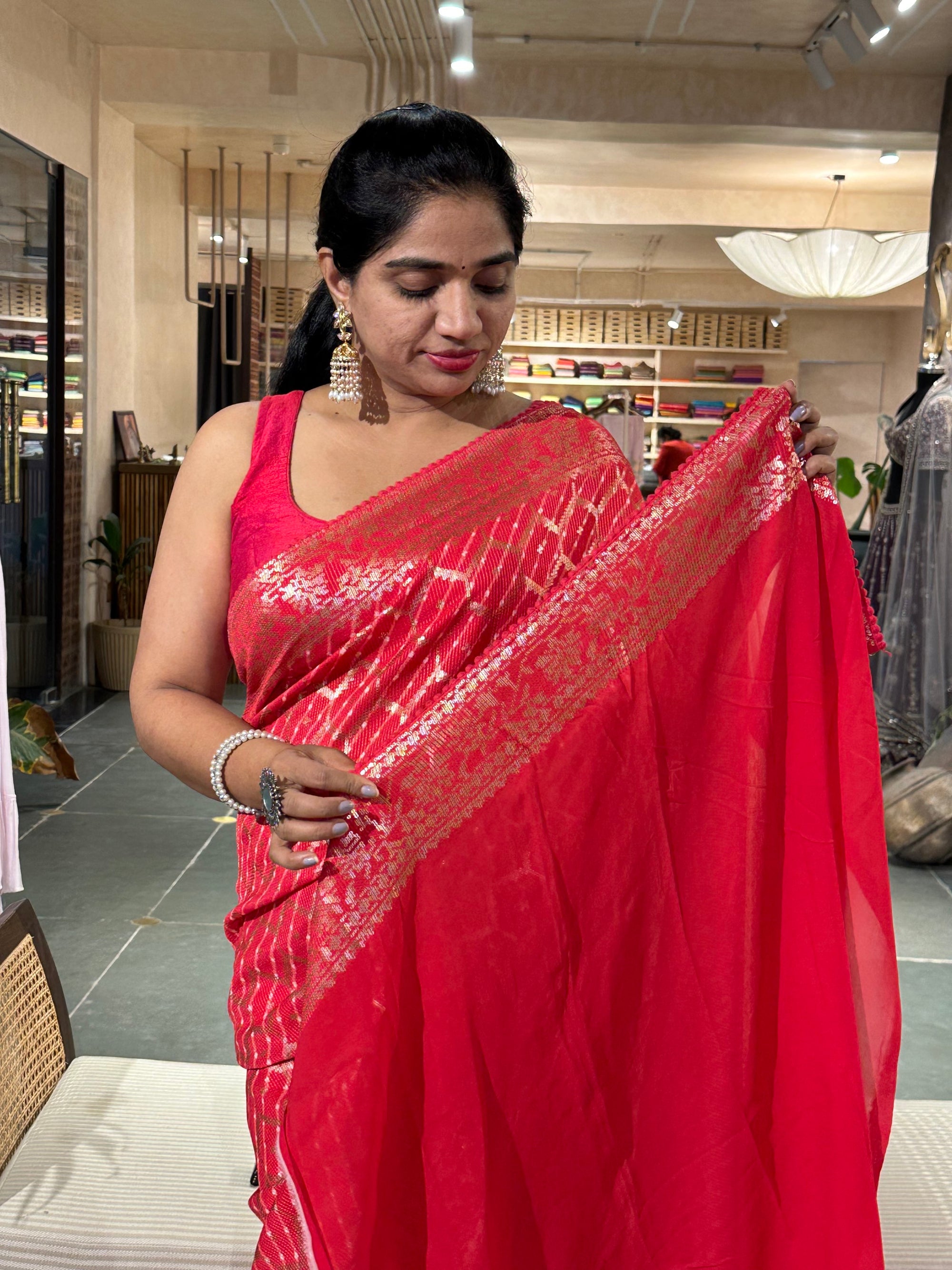 Pinkish Red Pure Gorgette Lehariya Bandhini Sequnce Saree