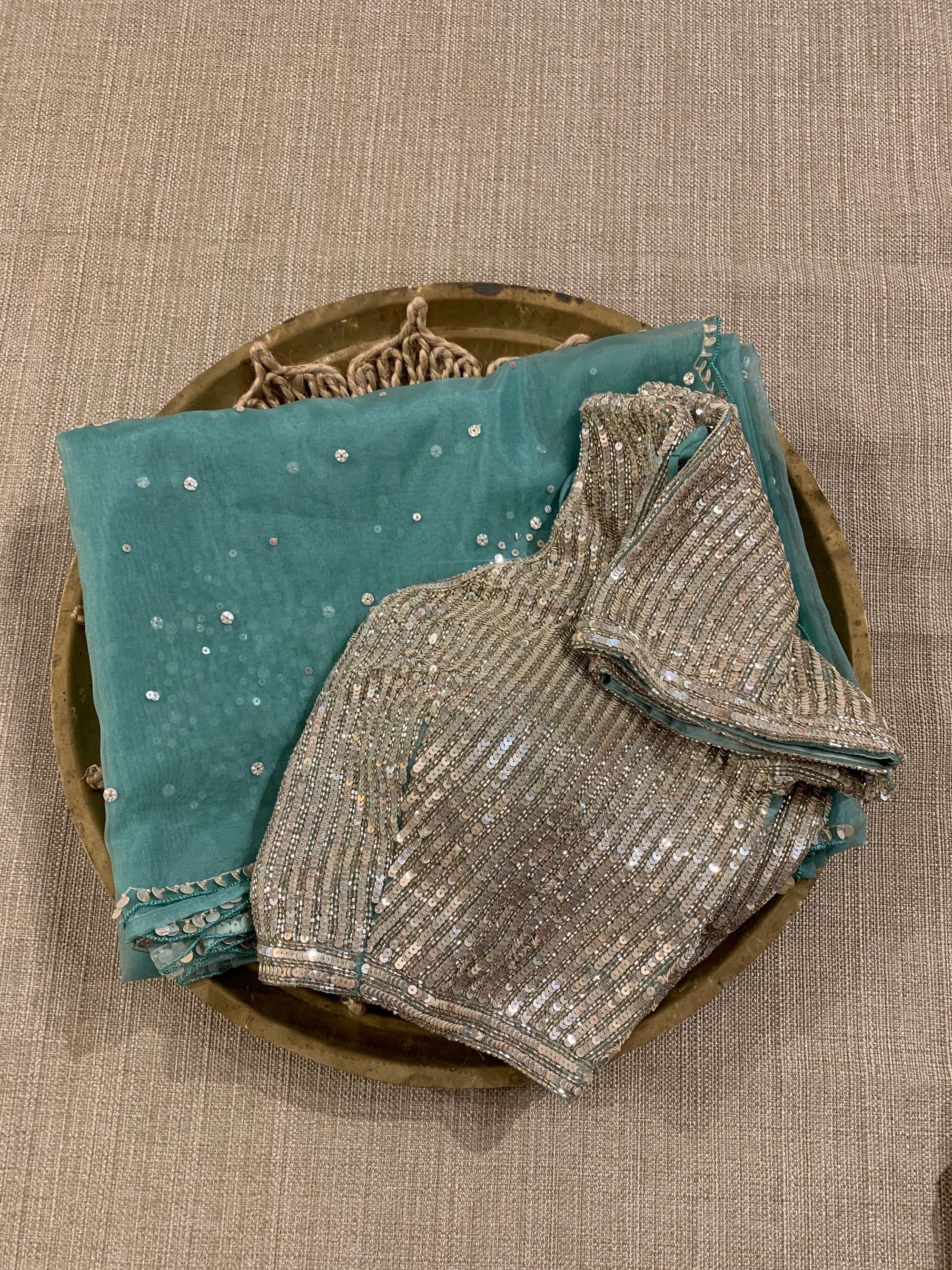 Sea Green Organza Saree with allover work and paired with heavy blouse