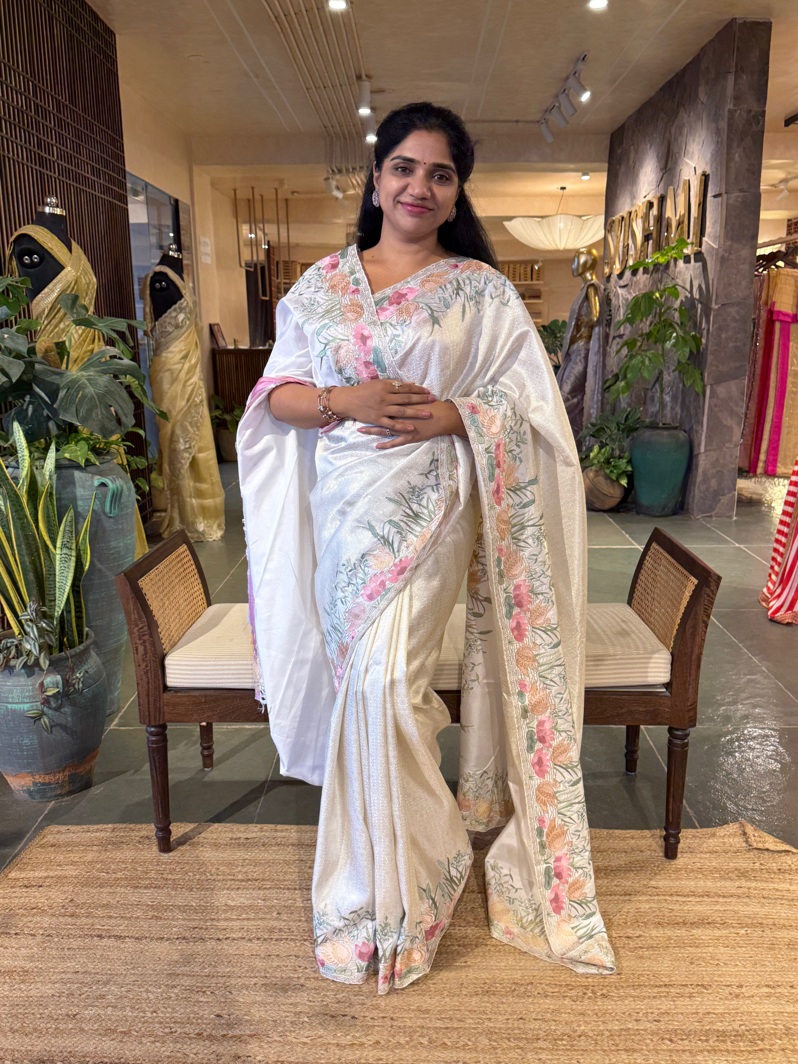 White Kanjeevaram Brocade Saree With Beautiful Pond Theme Embroidered Border.